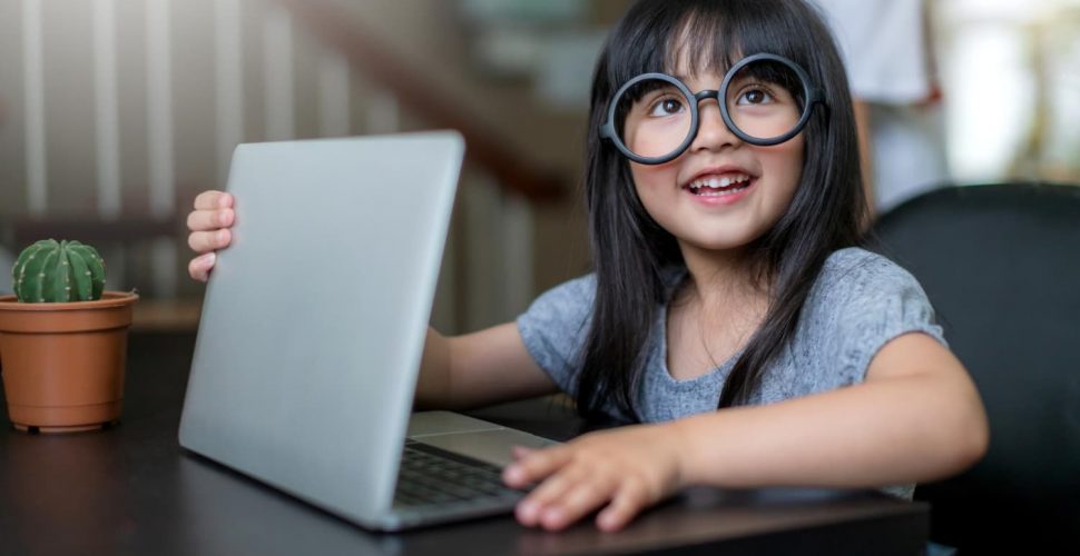 little-adorable-daughter-wear-glasses-have-fun-playing-laptop-pretenting-work-home-background