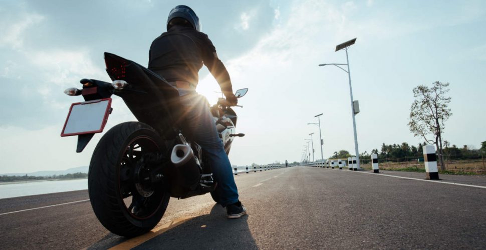 Rider Motorbike on the road riding. having fun driving the empty road