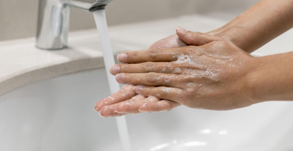 person-washing-hands-close-up