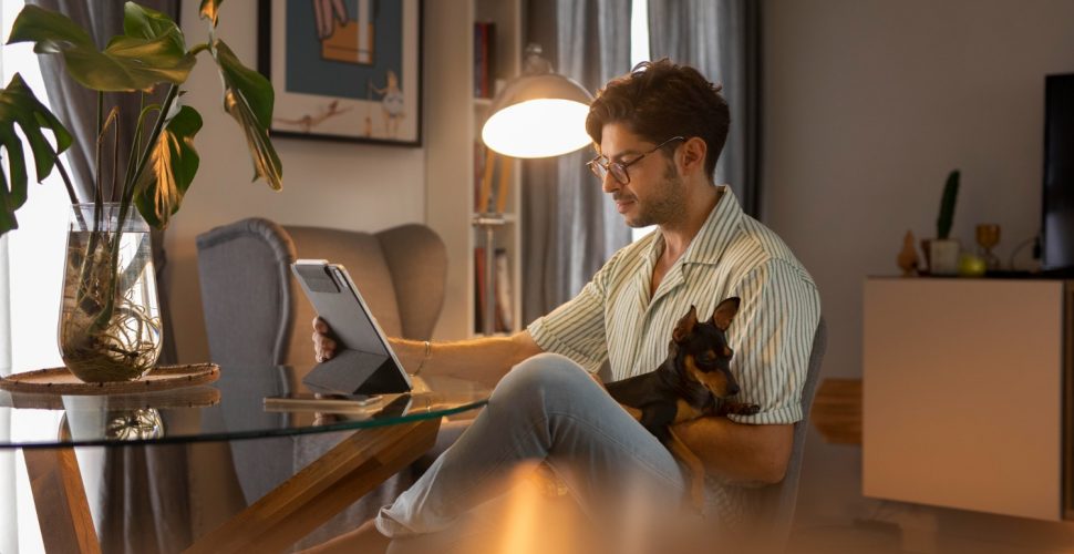 person-working-from-home-with-pet-dog